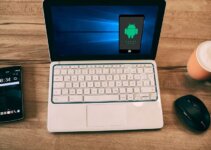 iOS emulator with laptop and iphone on a coffee table