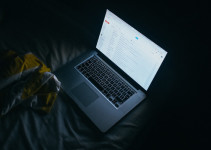 Reading email and surfing the web at night in bed on a laptop