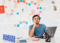 Man using one of the best essay writing apps to develop his novel