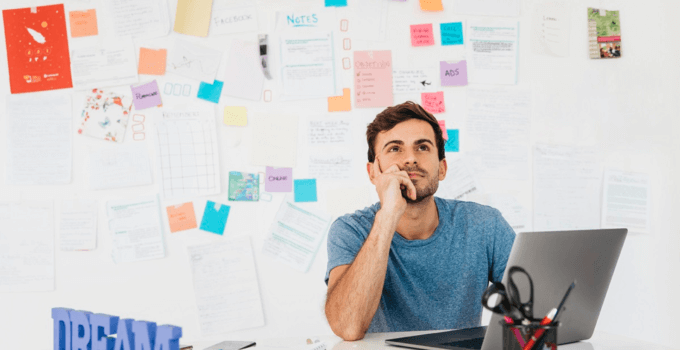 Man using one of the best essay writing apps to develop his novel