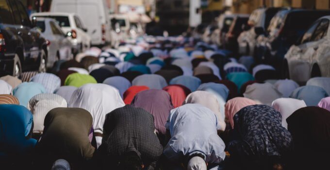 people kneeling and praying during daytime