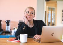 Woman in black long sleeve shirt disappointed with video chat