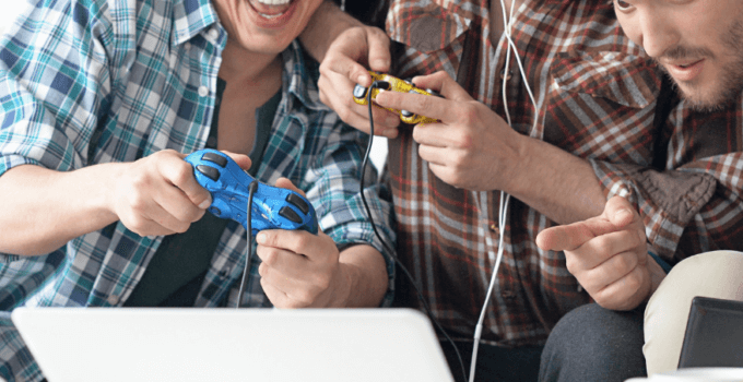 3 men playing games in their gaming room