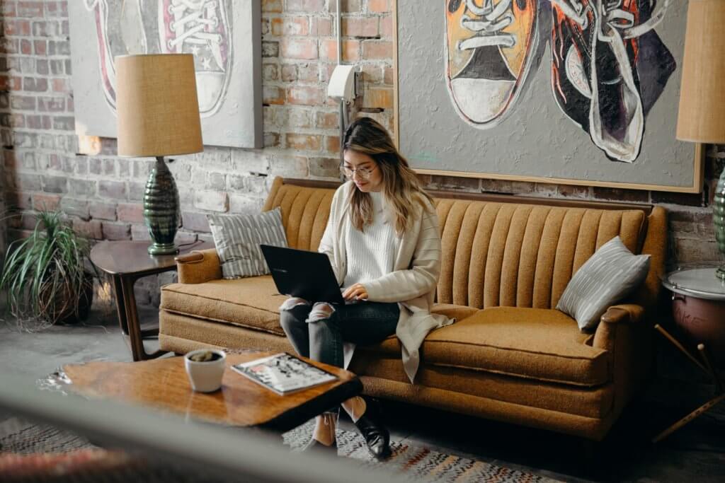 Woman using laptop to work remotely