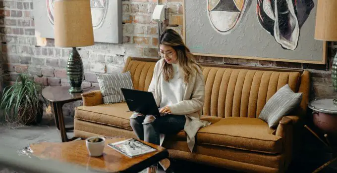 Woman using laptop to work remotely