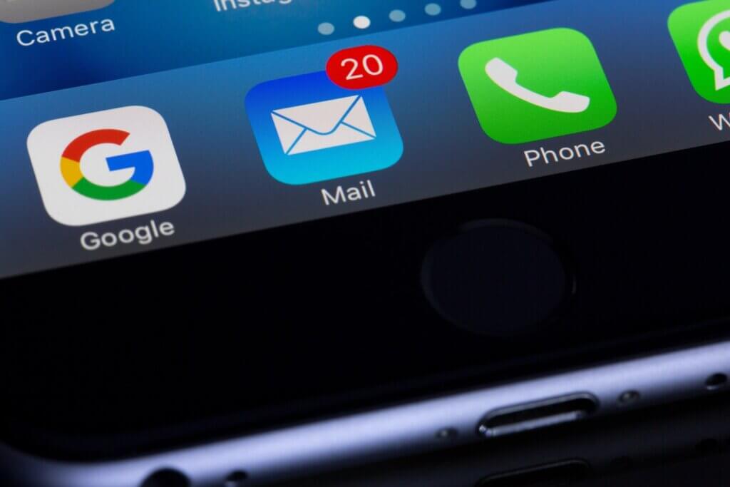 Image of a laptop screen showing the Gmail icon with 20 unread messages