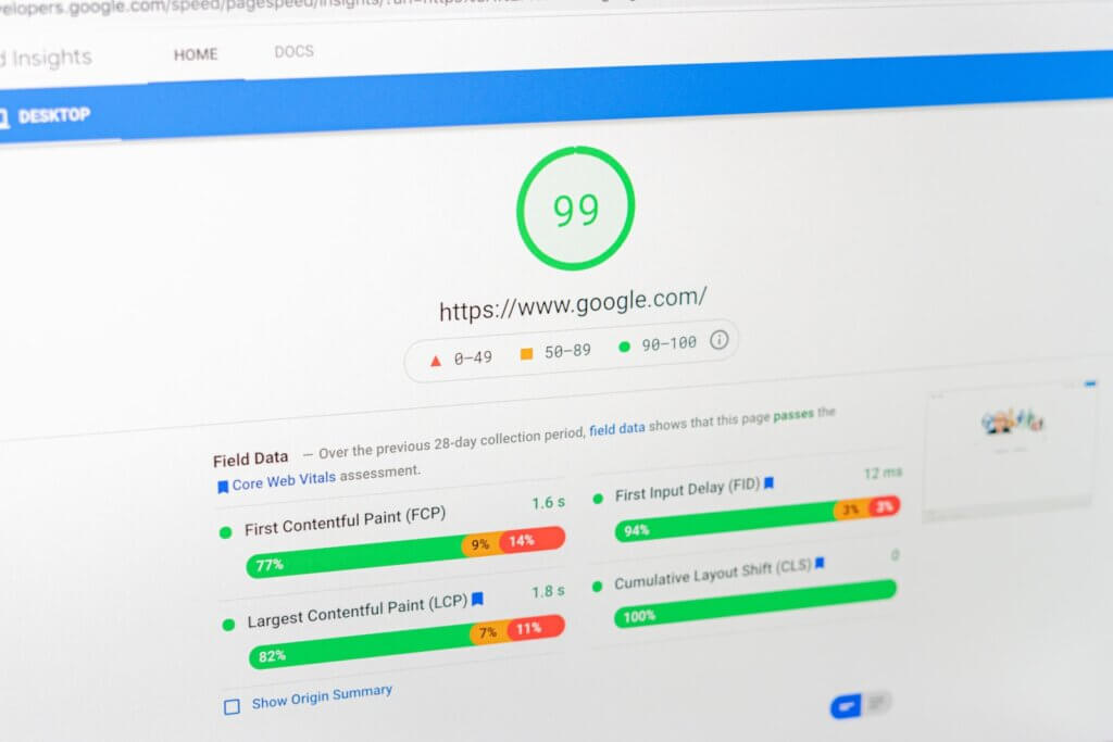 Google PageSpeed Insights on a laptop screen showing performance of google.com.