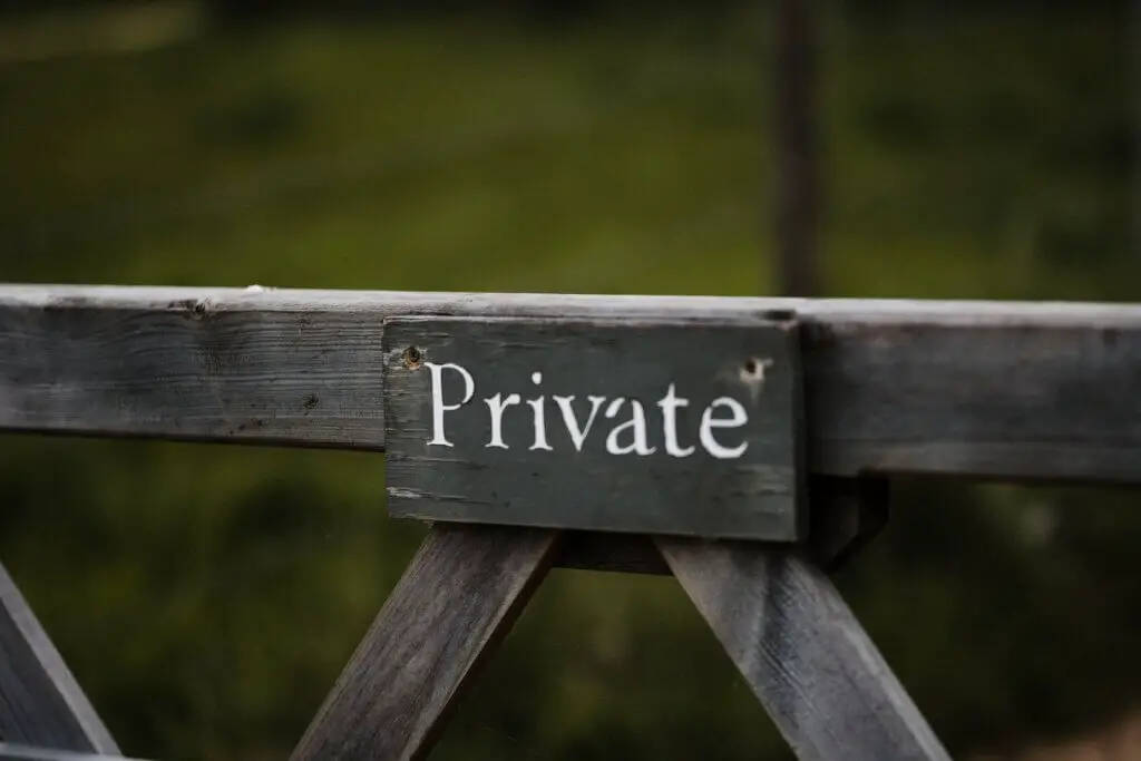 Private sign on gate to the beach