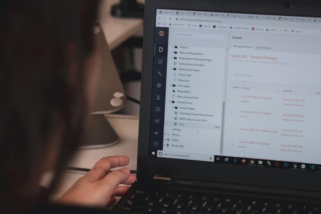 VPNs encrypt traffic between two computers Person connected to company resources using black laptop and secure remote access controls