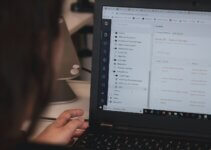 Person securely connected to company resources using black laptop