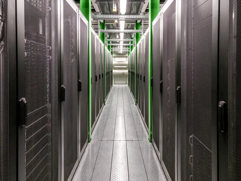 Data center corridor showing lots of servers in racks