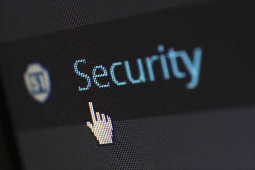 Security Image computer screen with a mouse pointer to click the security tab link