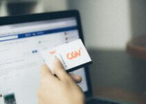 checking the details of the theater movie ticket