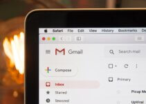 Black laptop computer with Gmail open in Safari browser using AImReply